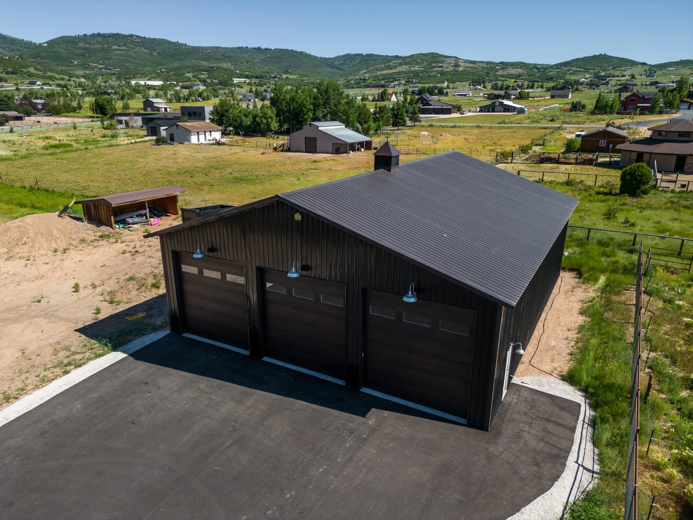 Black 3-bay steel garage
